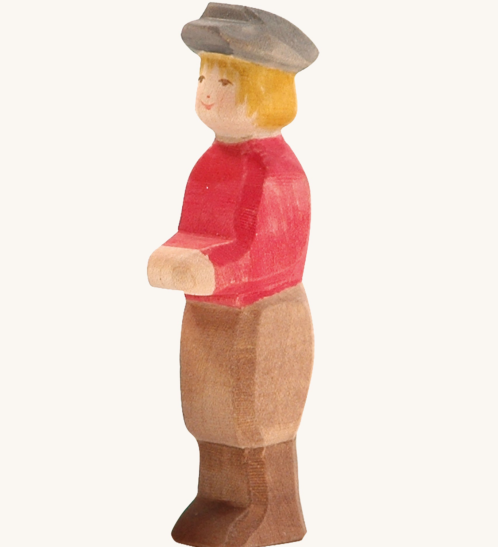 Ostheimer Son wooden figure with white Skin on a plain background. 