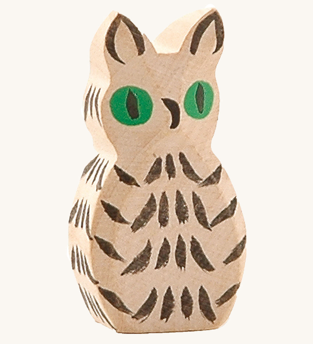 Ostheimer white wooden owl figure on a plain background. 