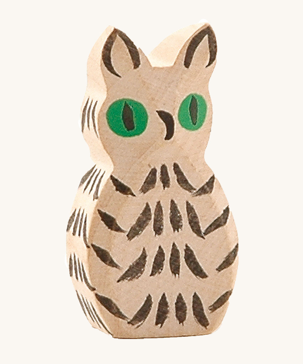 Ostheimer white wooden owl figure on a plain background. 