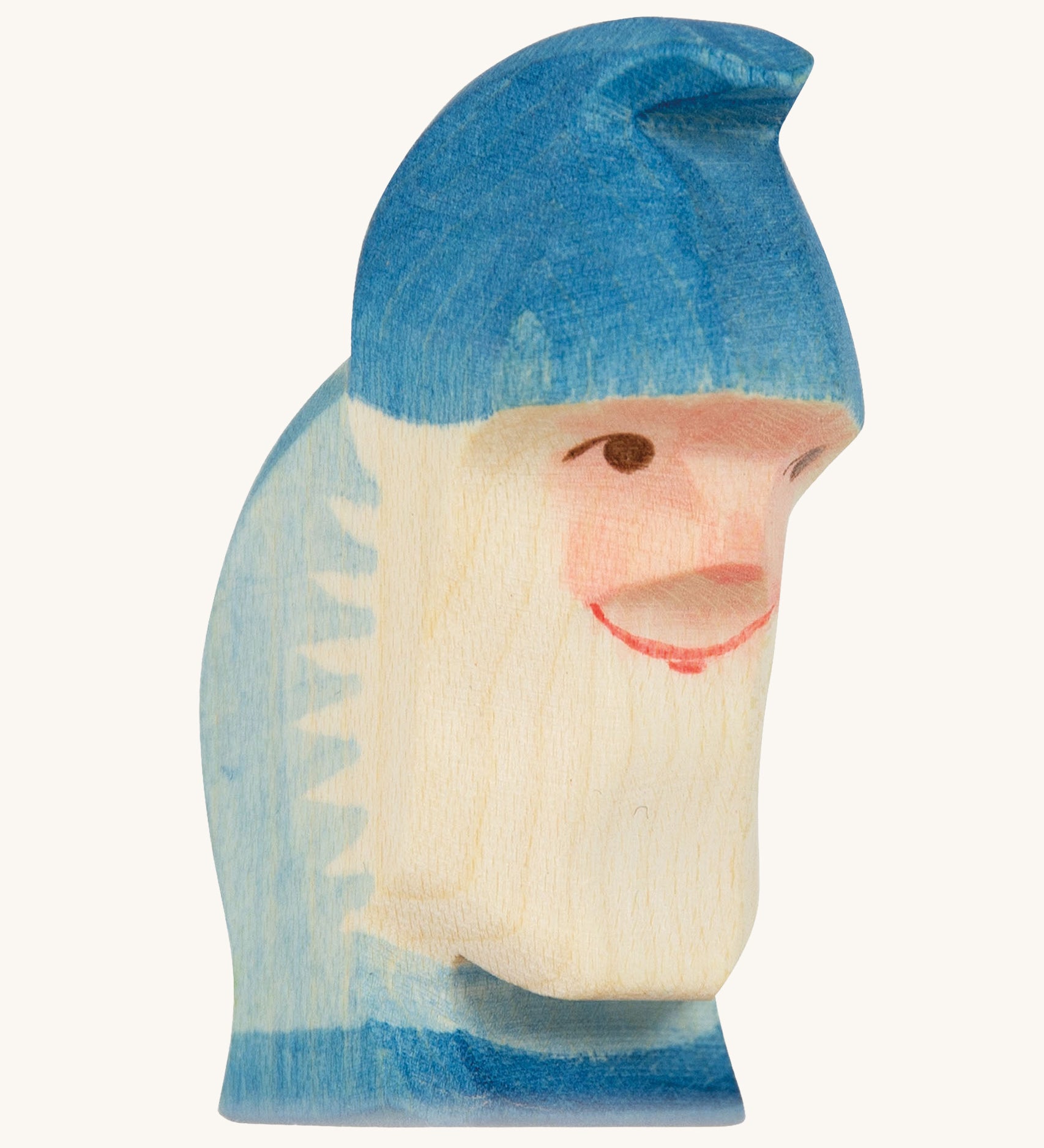 A blue wooden Ostheimer dwarf figure on a cream background.