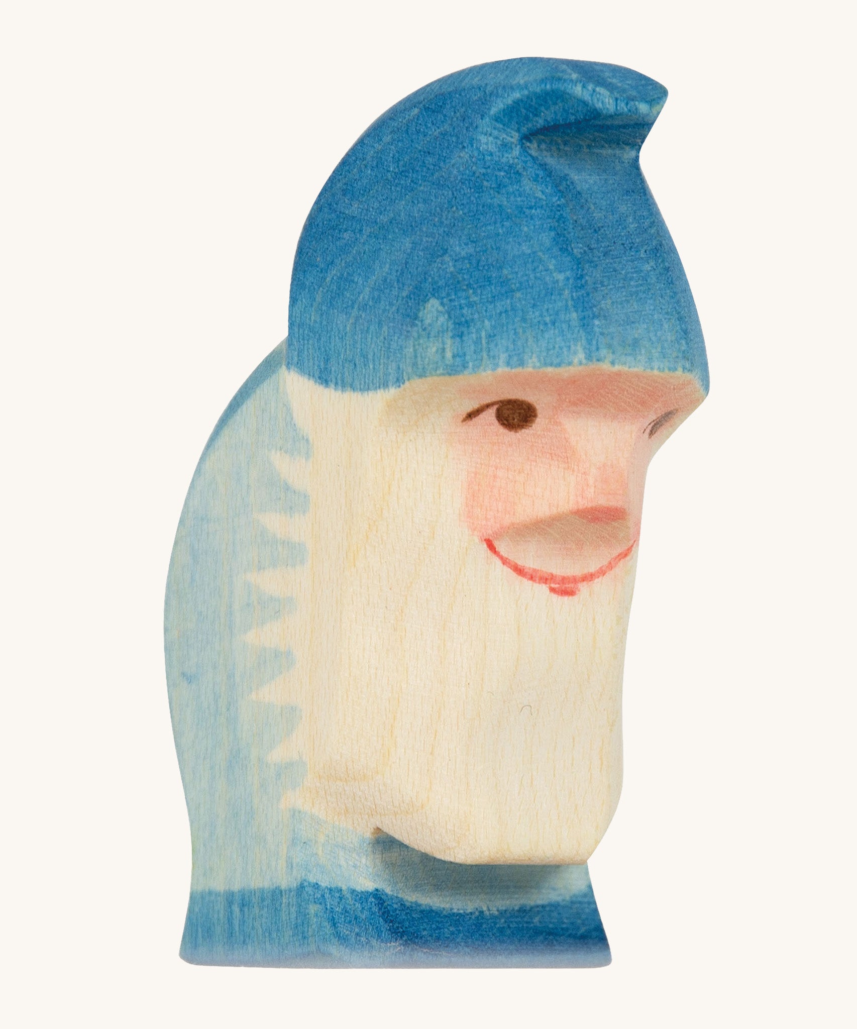 A blue wooden Ostheimer dwarf figure on a cream background.