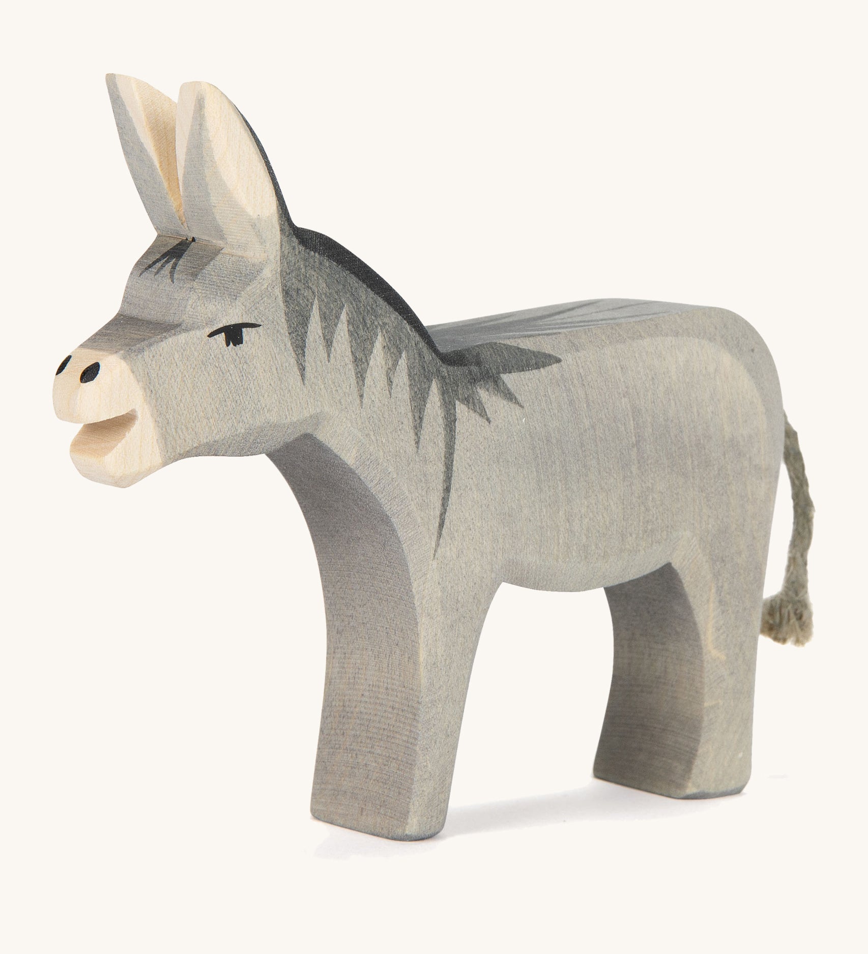 A wooden Ostheimer bremer standing donkey on a cream background. 