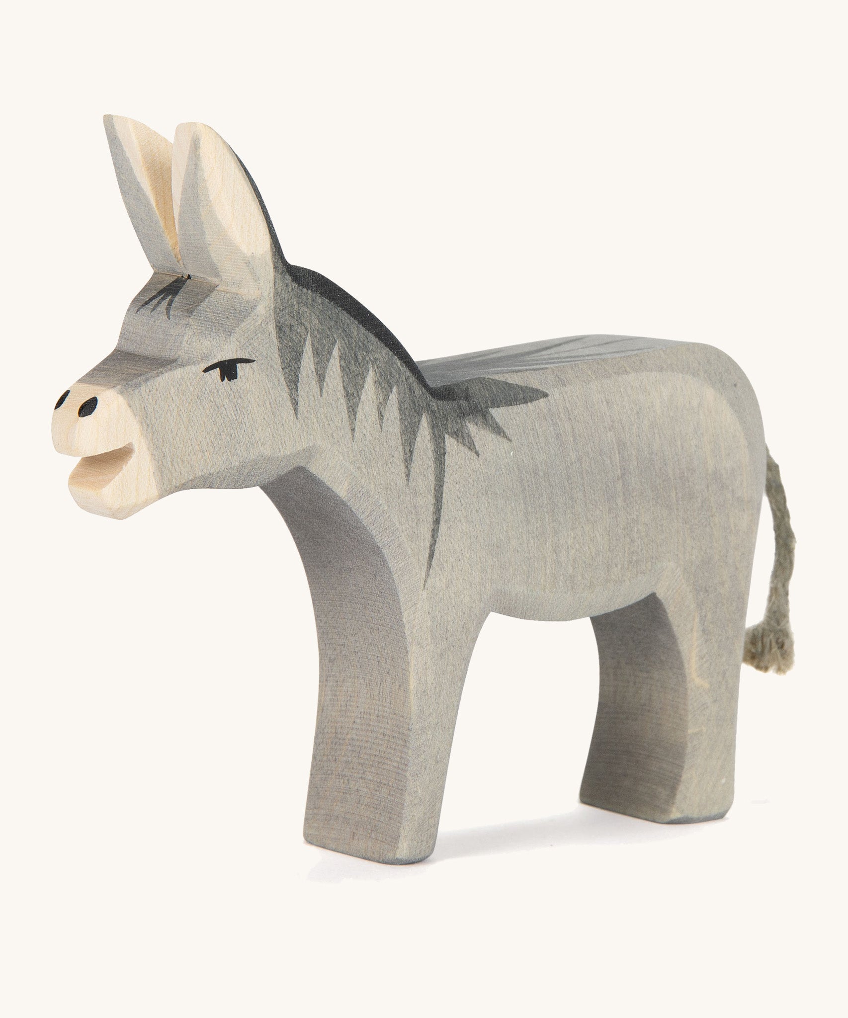 A wooden Ostheimer bremer standing donkey on a cream background. 