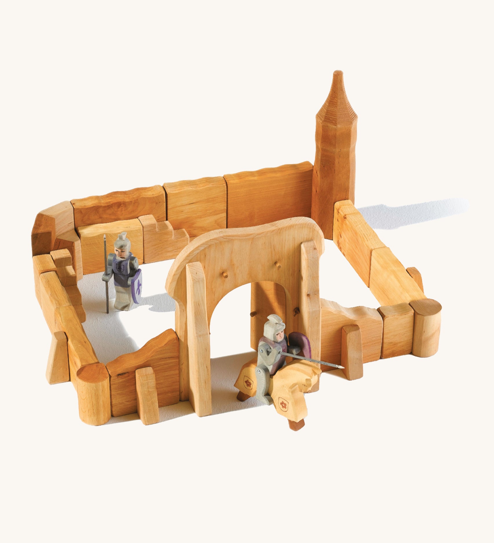 Ostheimer kids handmade wooden castle playset laid out on a cream background