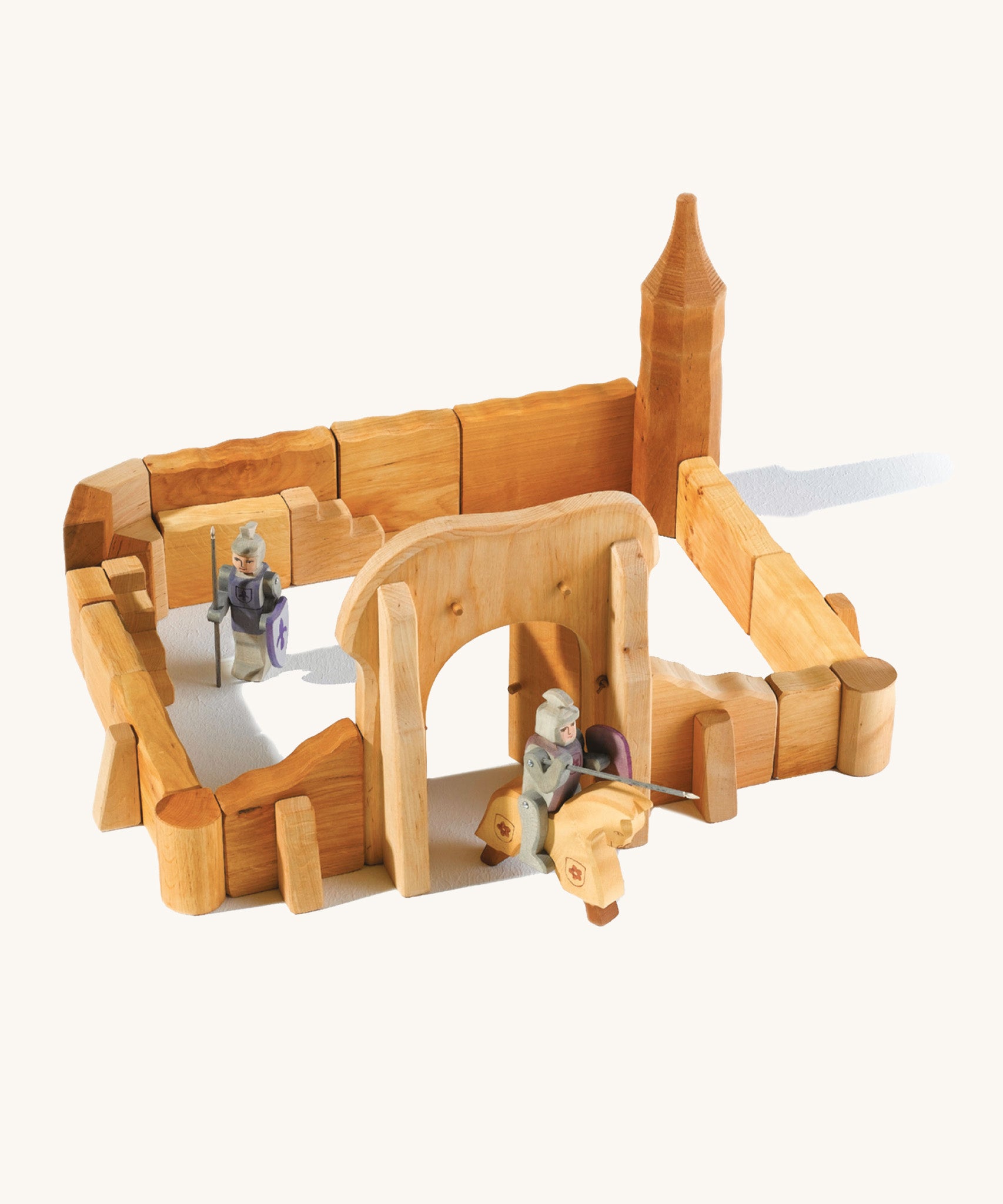 Ostheimer kids handmade wooden castle playset laid out on a cream background