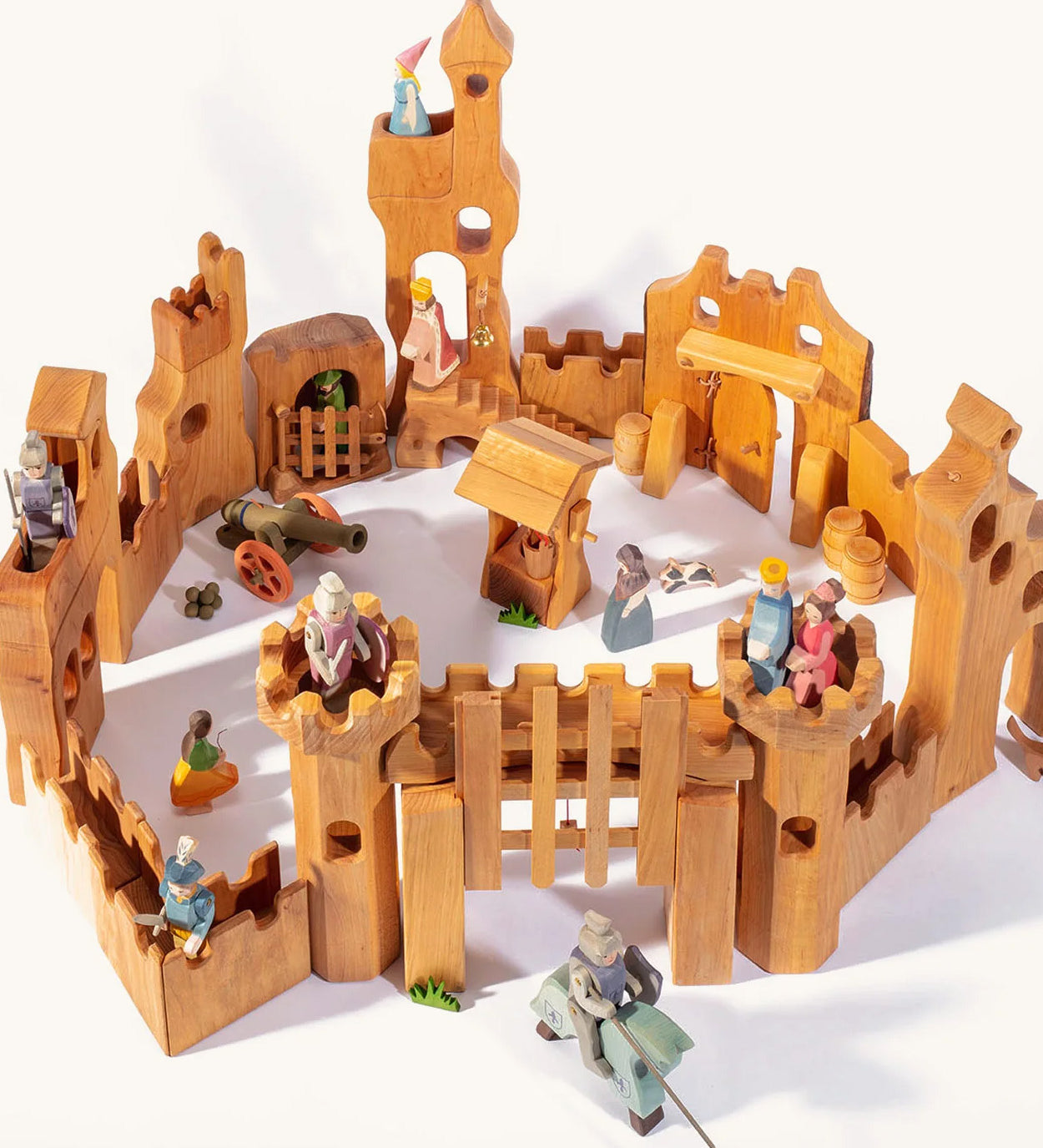 Ostheimer children's wooden castle set laid out on a beige background