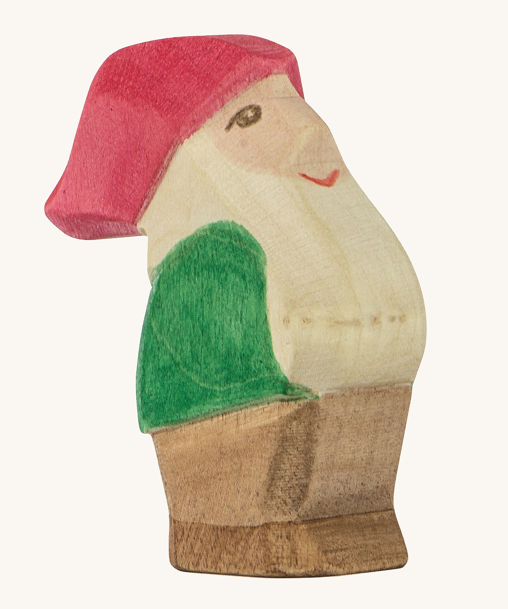 A wooden Ostheimer Eugen dwarf figure wearing a green top, brown trousers and a red hat on a cream background.