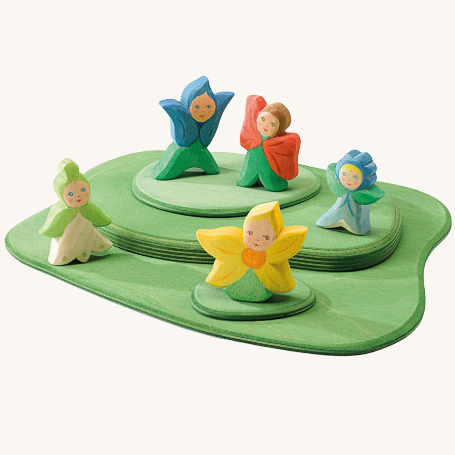 The Ostheimer Wooden Flower Children all playing together on the Ostheimer Wooden Meadow pieces. All of the Ostheimer Wooden Flower Children are handmade and hand crafted from natural wood