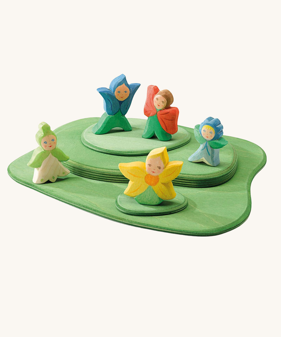 The Ostheimer Wooden Flower Children all playing together on the Ostheimer Wooden Meadow pieces. All of the Ostheimer Wooden Flower Children are handmade and hand crafted from natural wood