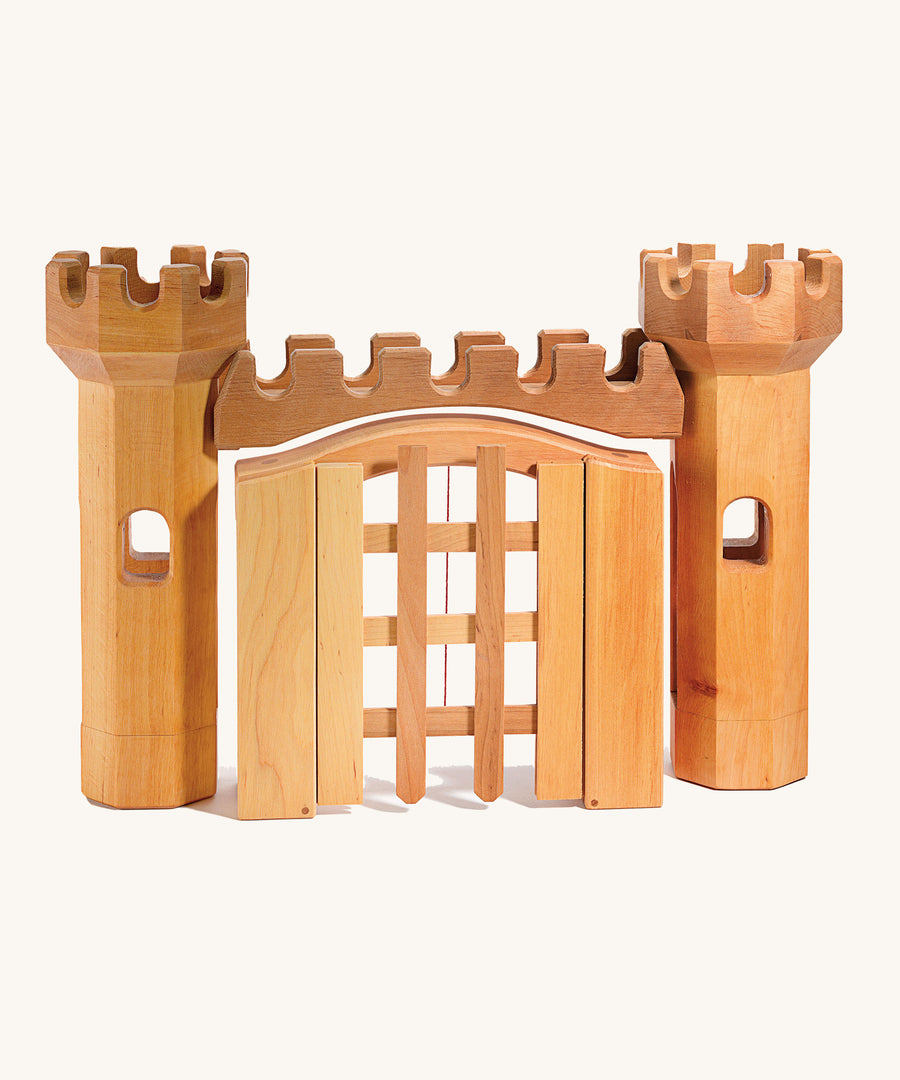 Ostheimer toy castle trellised gate and towers (available separately) on a cream background