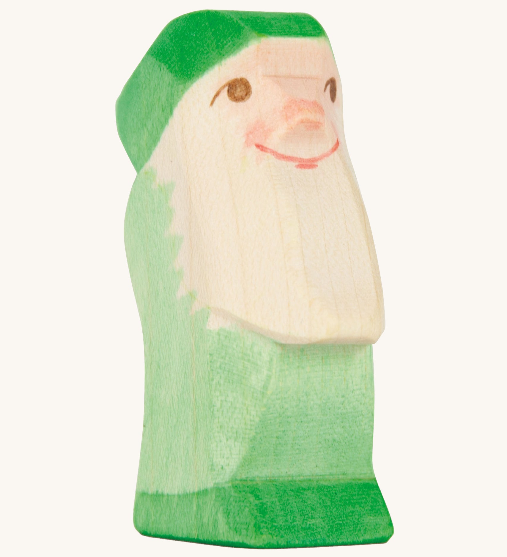 A green wooden Ostheimer dwarf figure on a cream background.