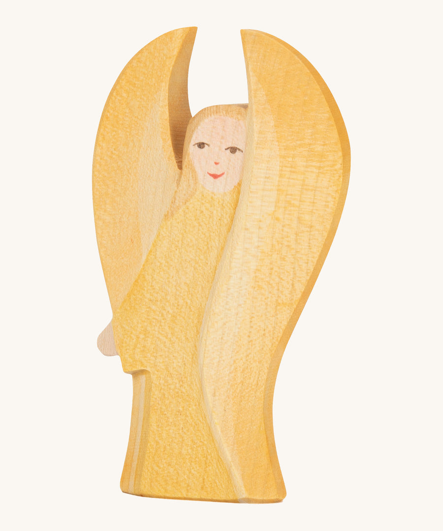 Ostheimer Yellow Guardian Angel figure on a cream background