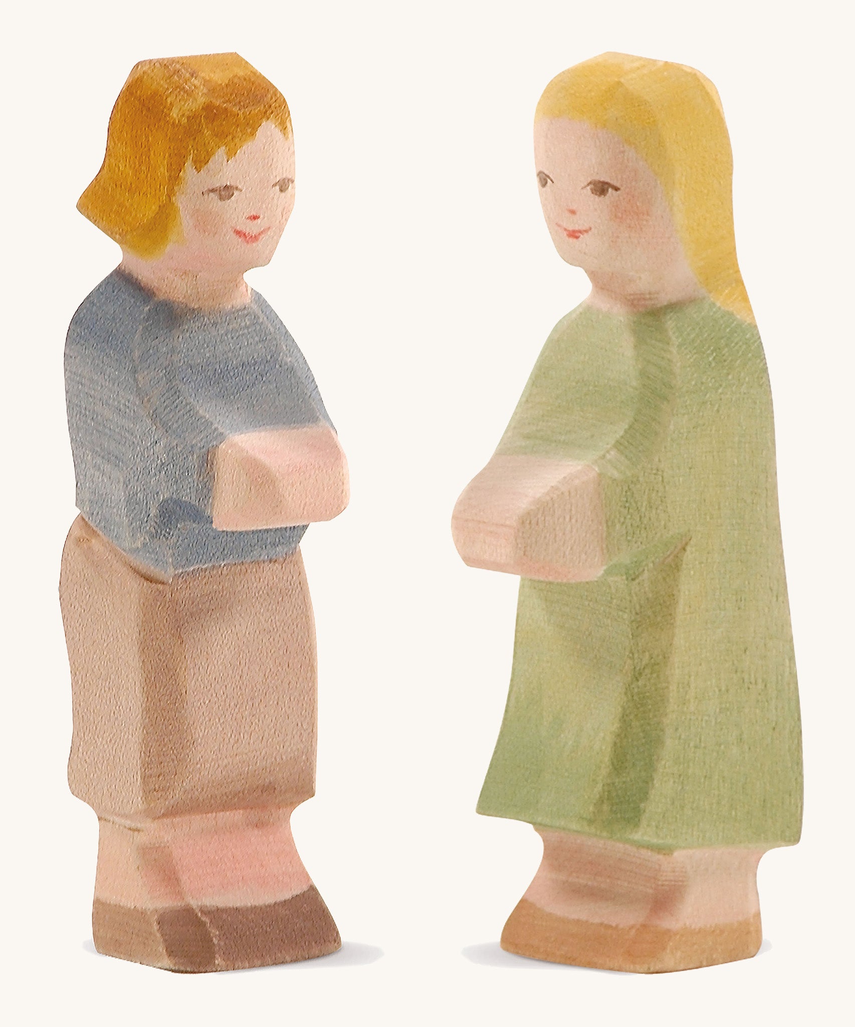 Ostheimer wooden Hansel and Gretel figures on a cream background.