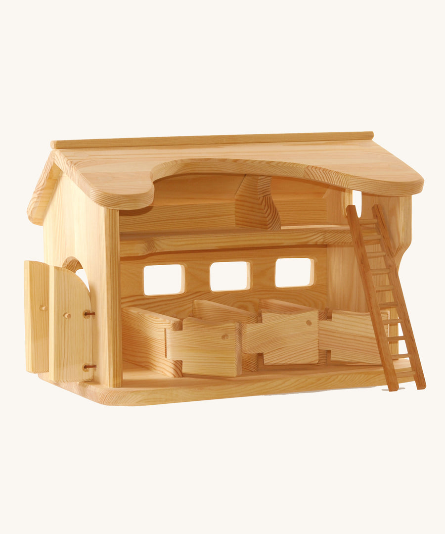 Ostheimer wooden Horse Stable for toy horses on a plain background.