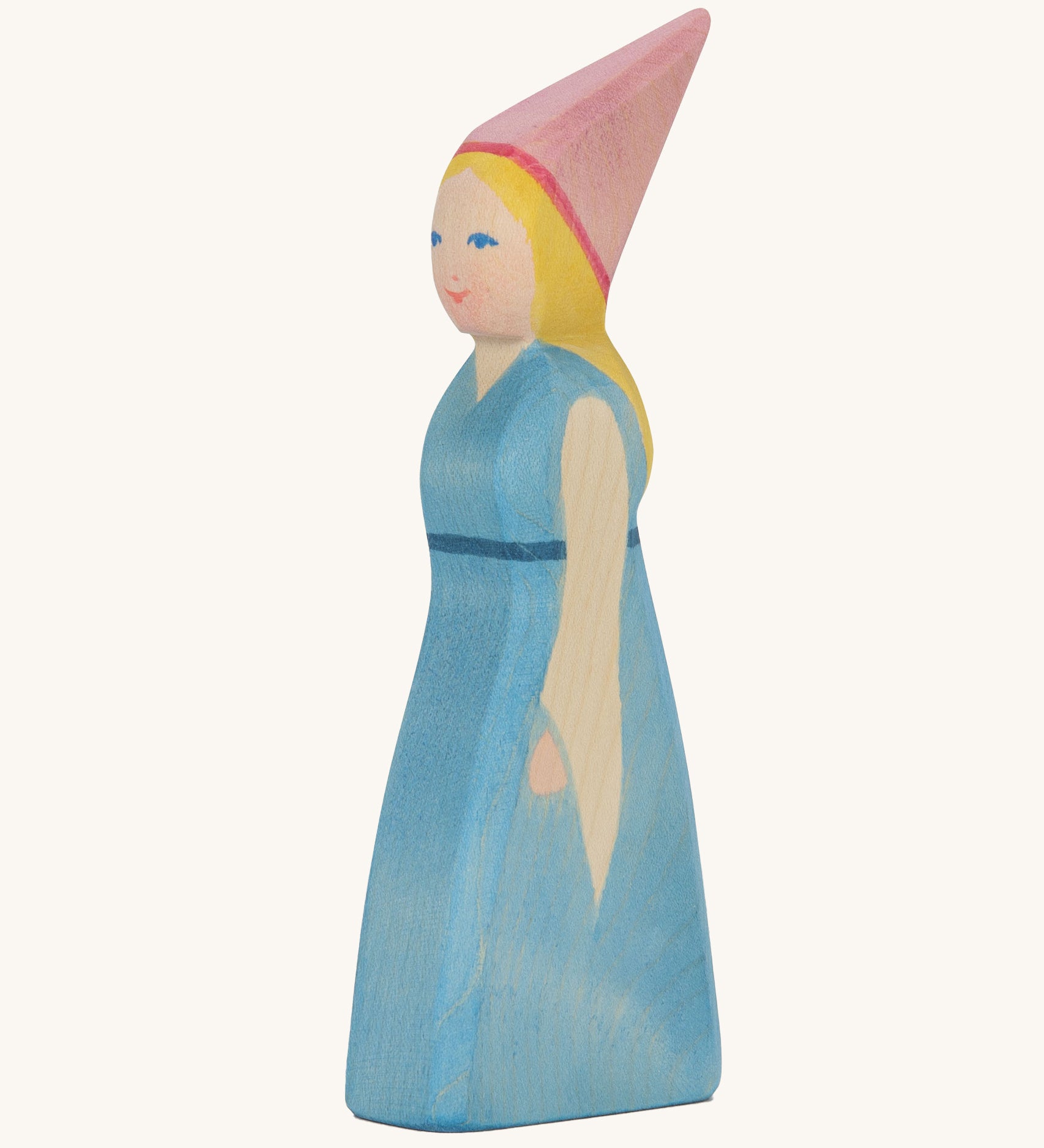 Ostheimer wooden princess with pink head piece and blue dress on a cream background