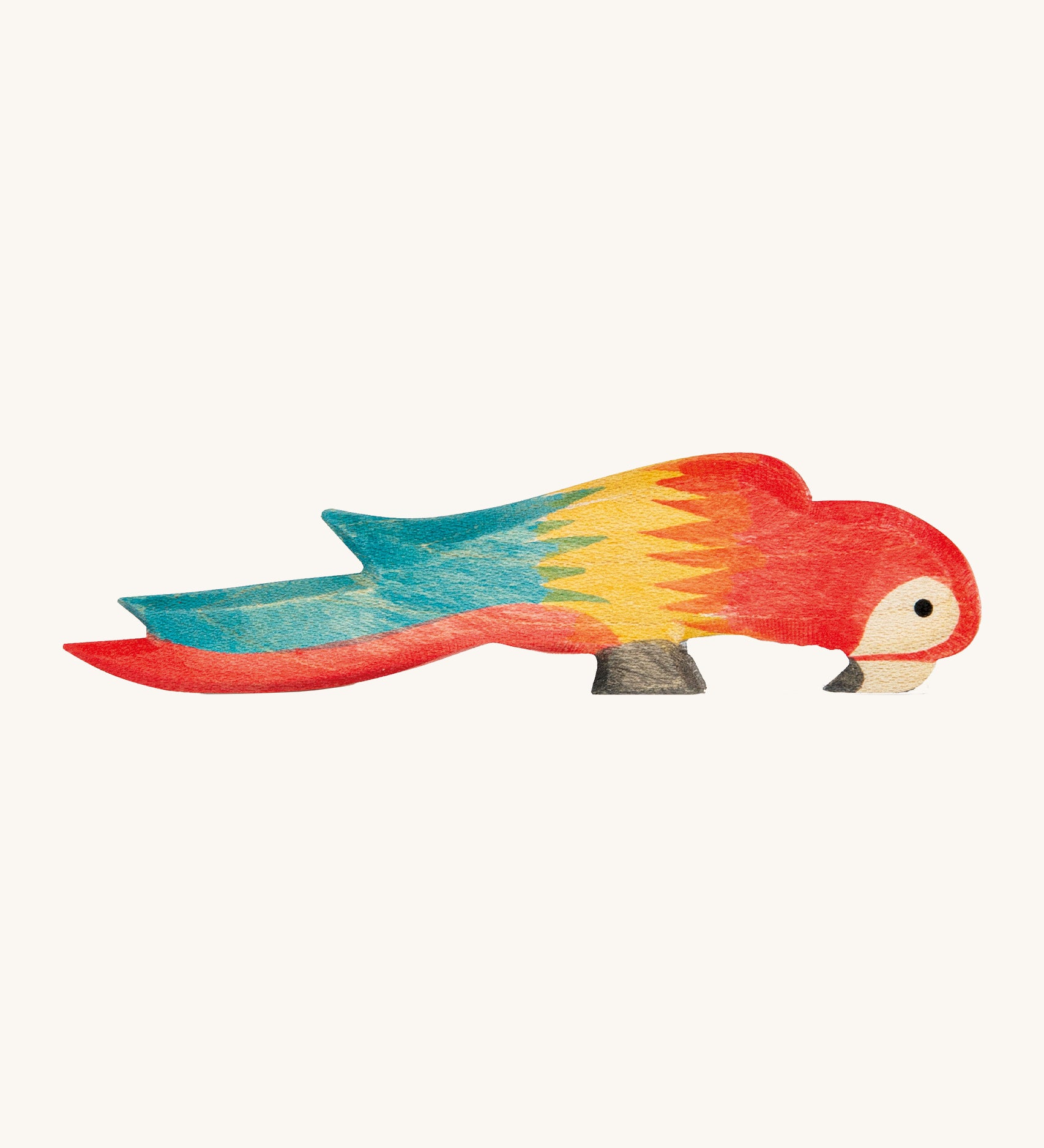 Ostheimer wooden multi-coloured parrot on a cream background.