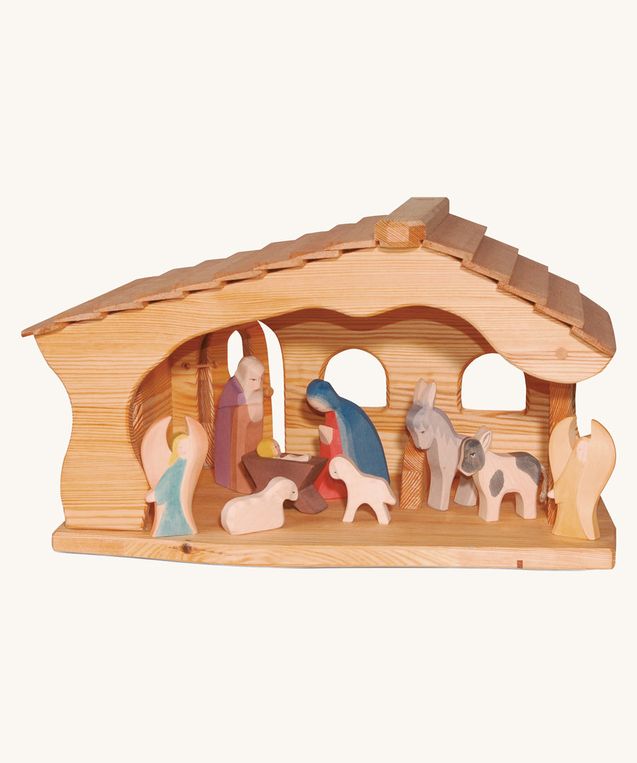 Ostheimer Nativity Stable on a plain background. The stable is filled with nativity figures. 