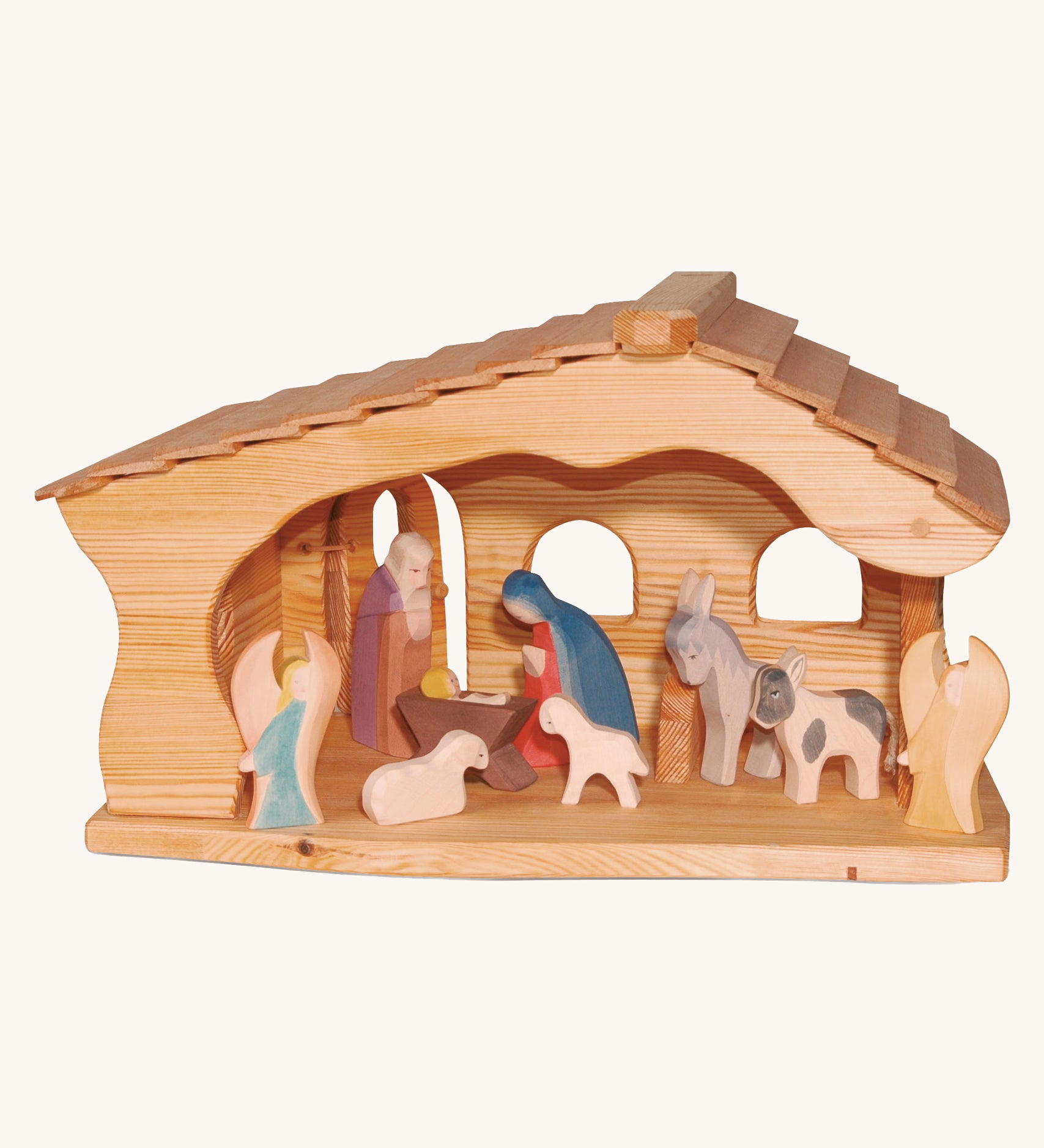 Ostheimer Nativity Stable on a plain background. The stable is filled with nativity figures. 