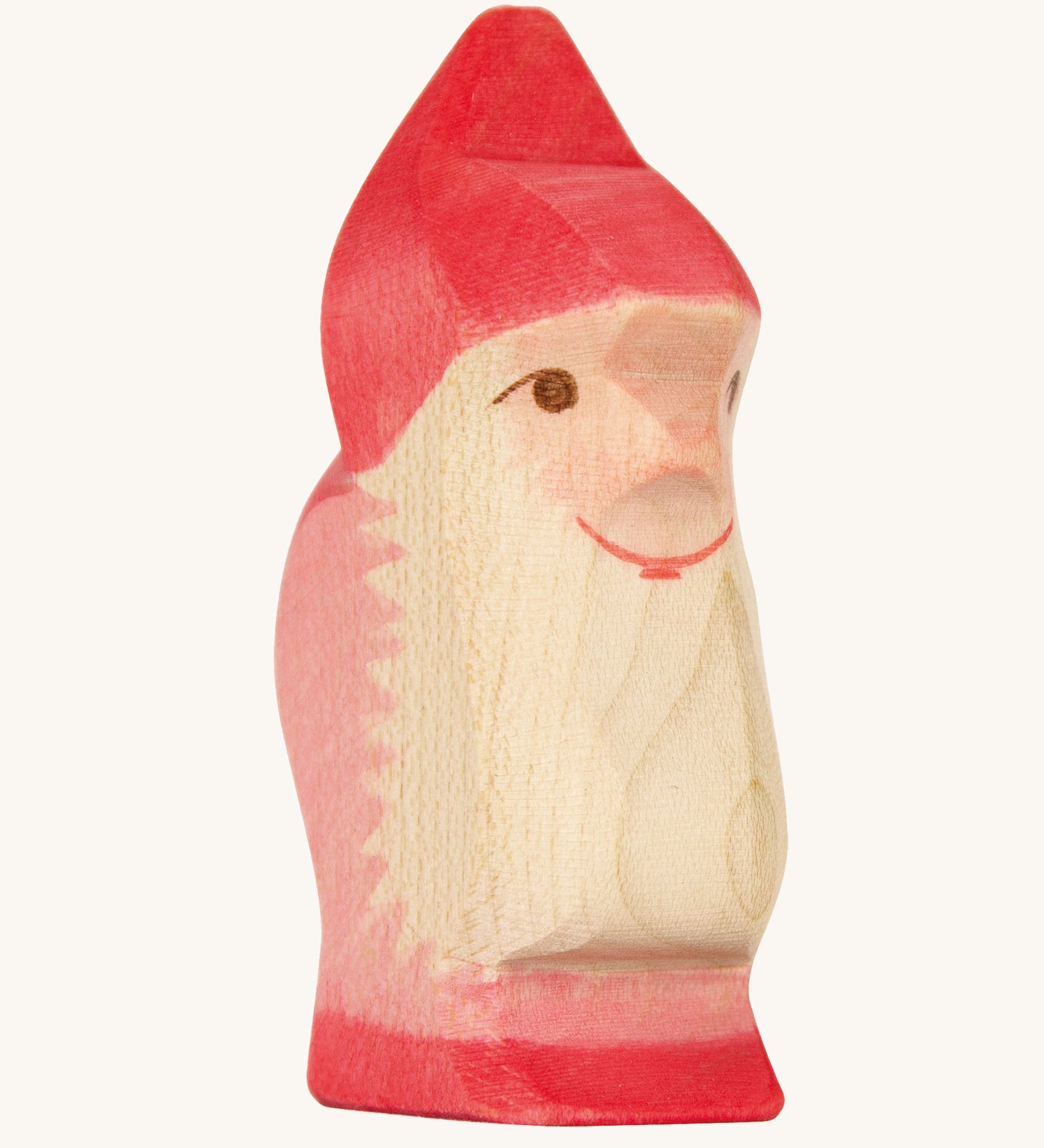 A red wooden Ostheimer dwarf figure on a cream background.