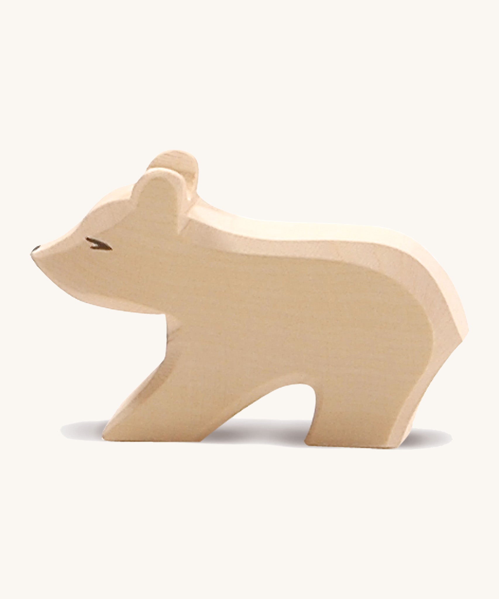 A small wooden Ostheimer polar bear figure with a short neck