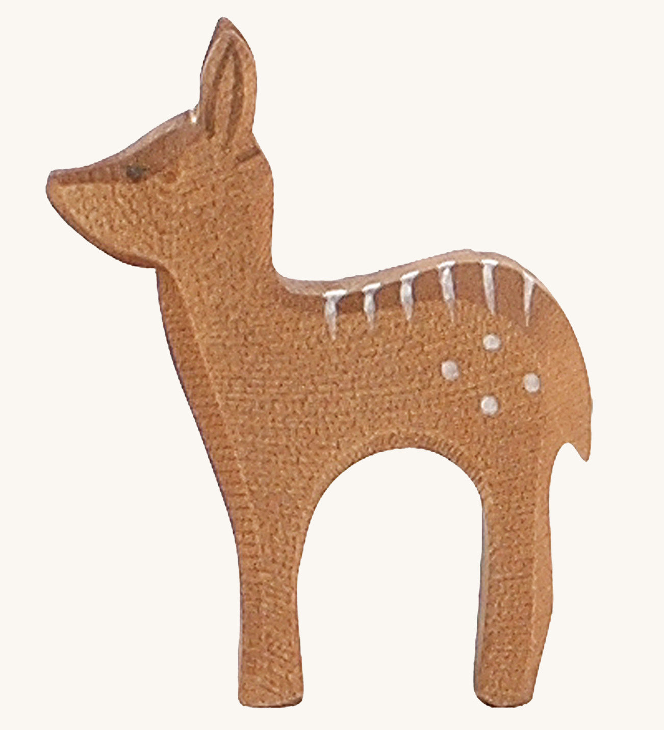 A wooden standing Ostheimer fawn figure on a cream background.