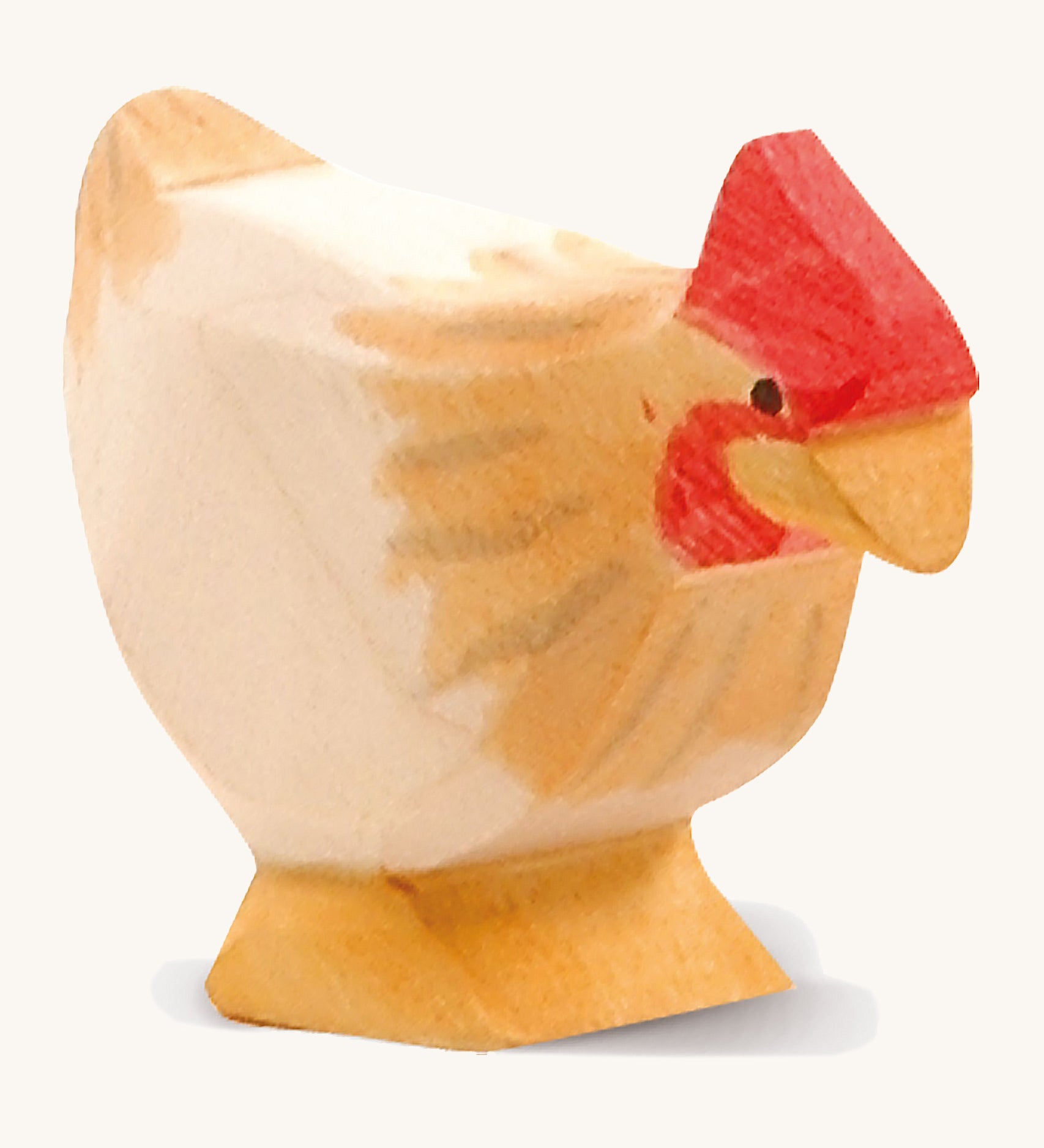 A ochre wooden standing Ostheimer hen figure on a cream background.