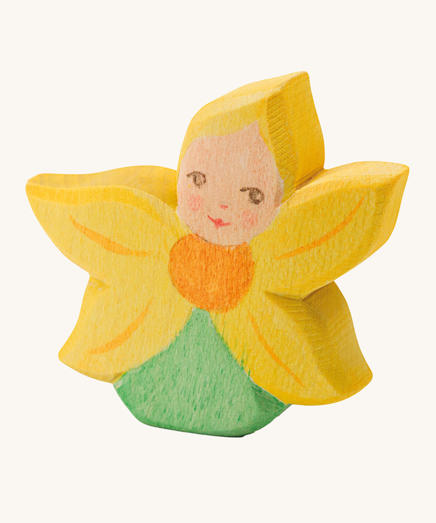 A wooden Ostheimer sunflower flower child figure on a cream background.