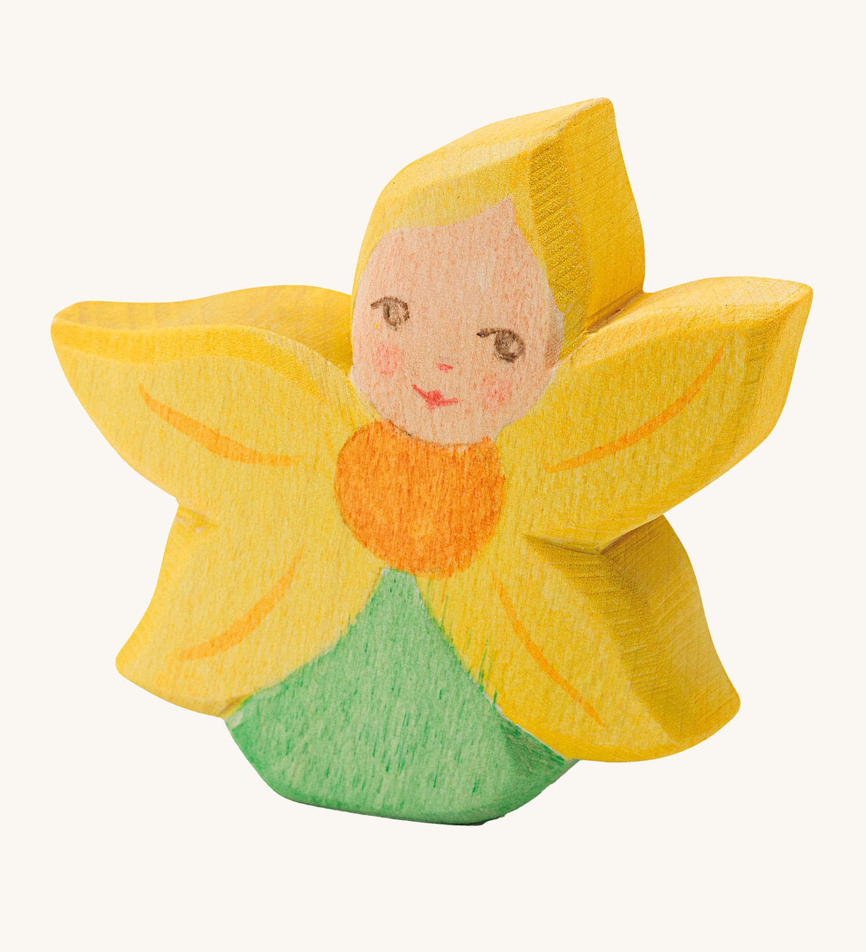 A wooden Ostheimer sunflower flower child figure on a cream background.