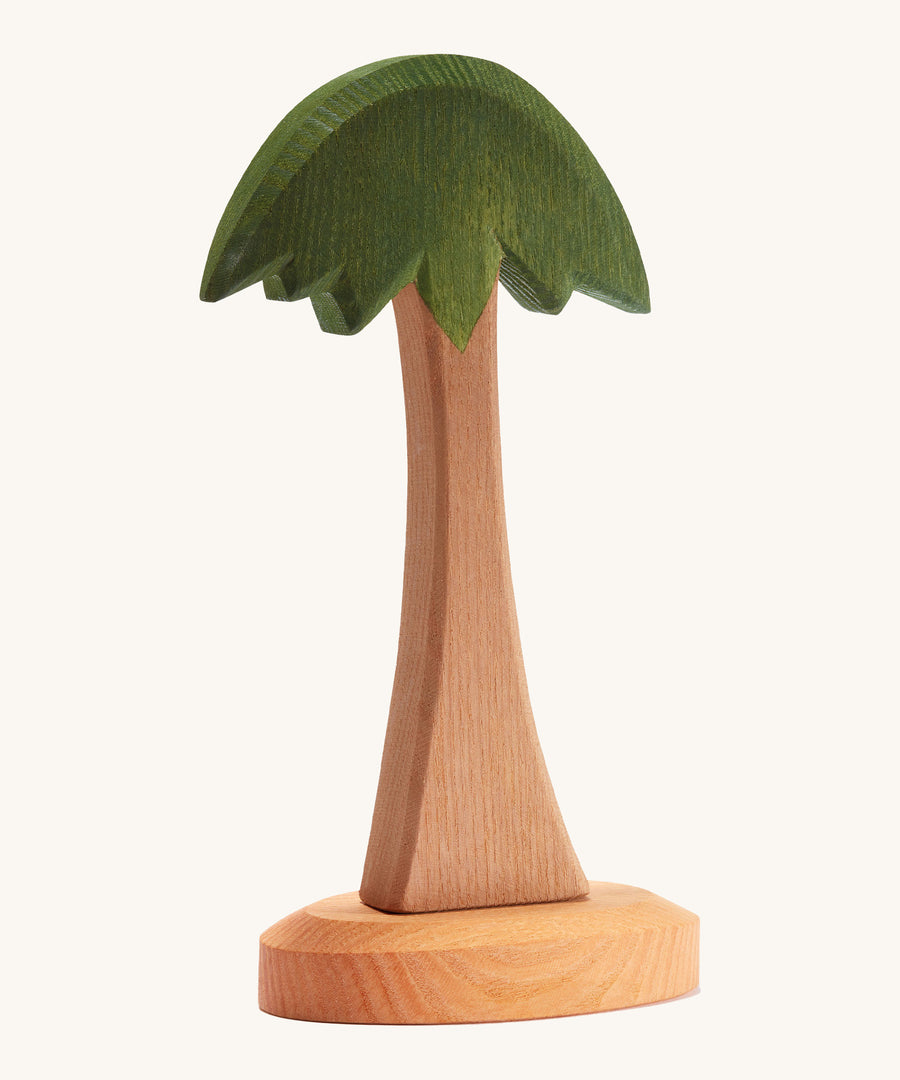 Ostheimer childrens handmade wooden palm tree toy on a cream background