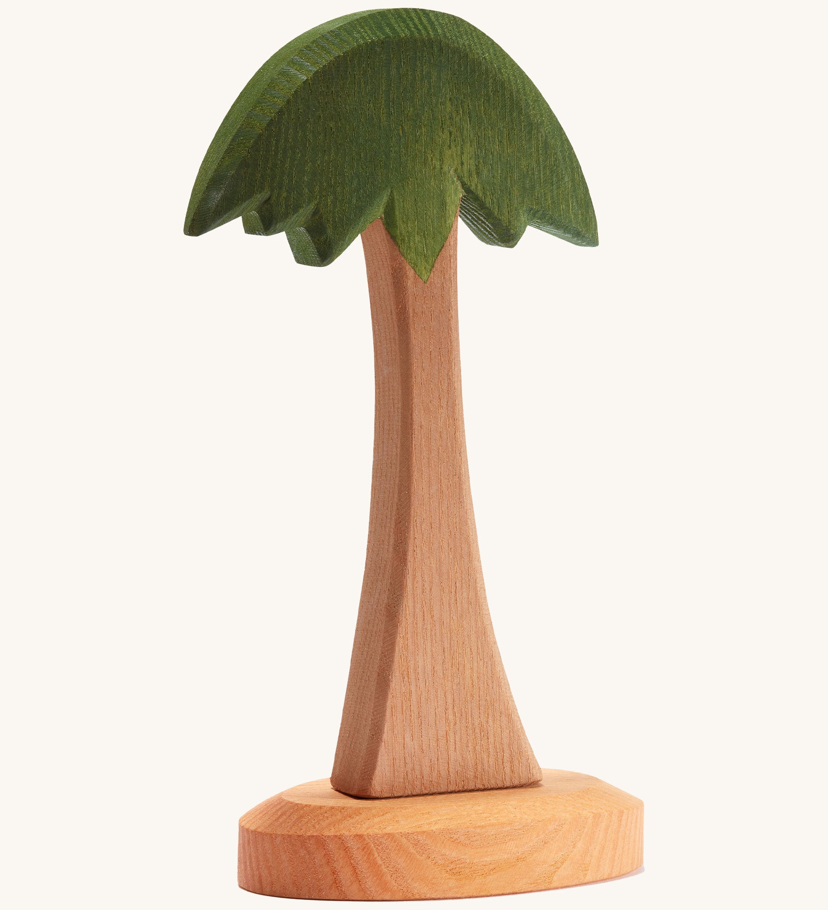 Ostheimer childrens handmade wooden palm tree toy on a cream background