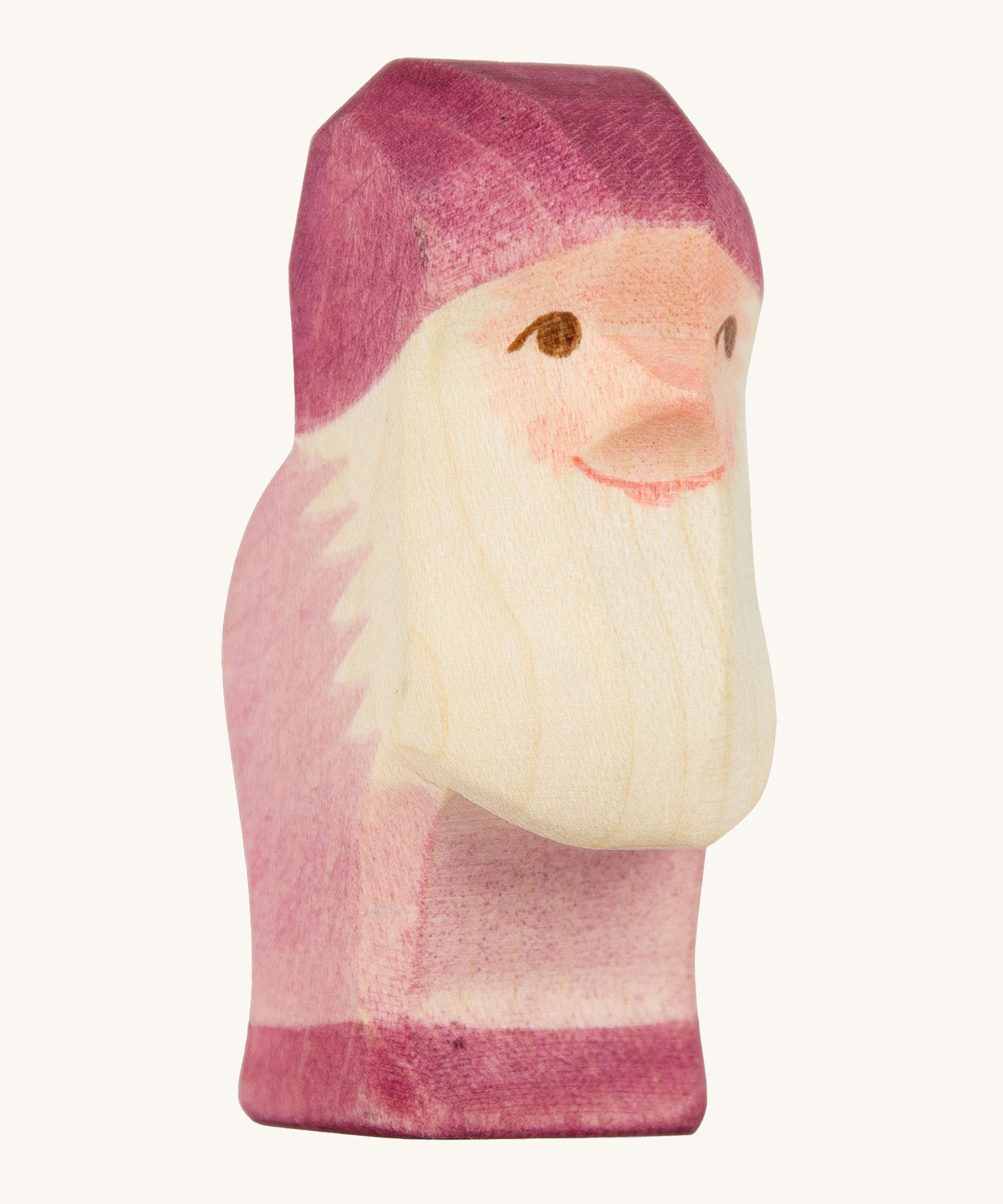 A violet wooden Ostheimer dwarf figure on a cream background.