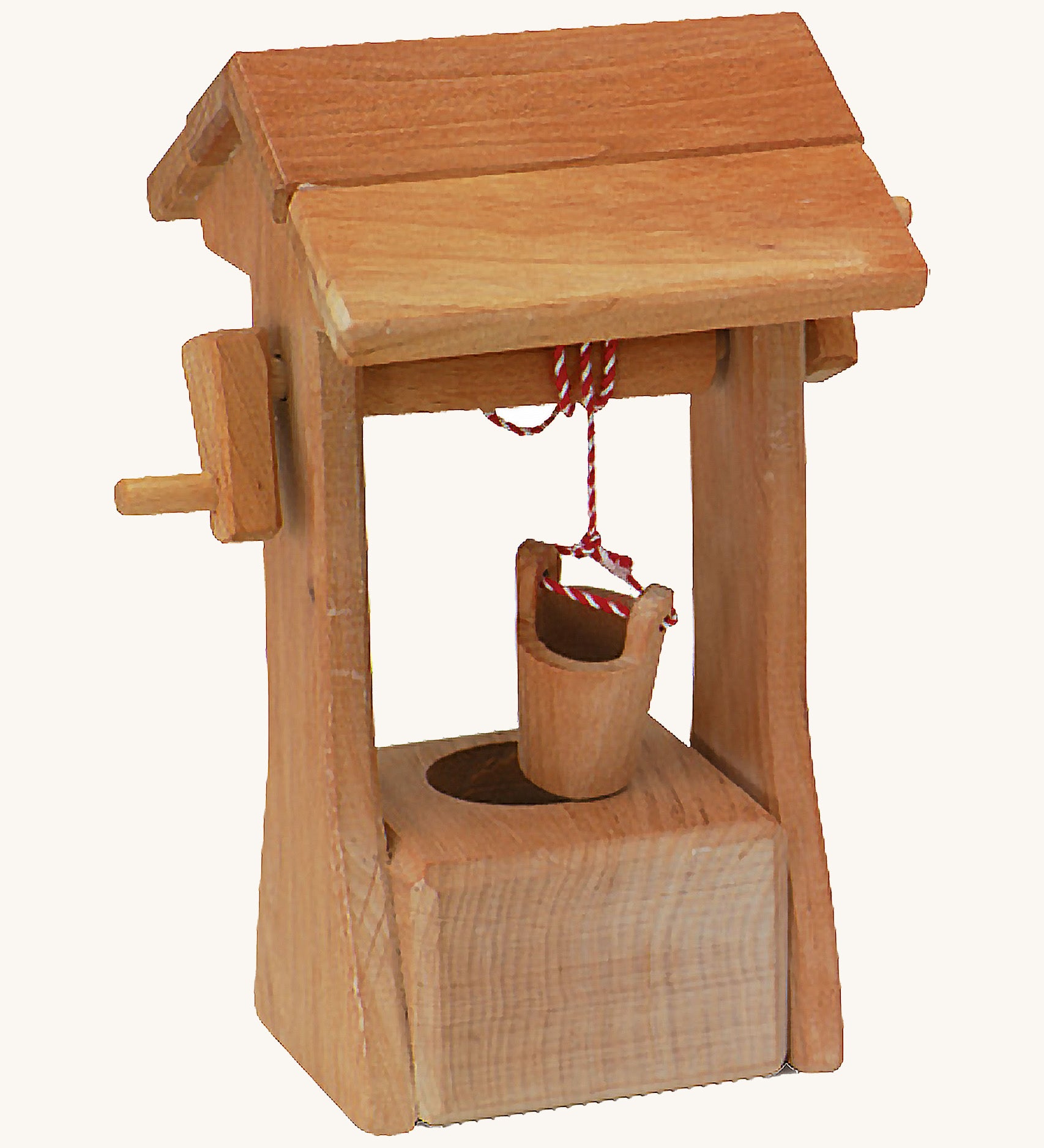 Ostheimer kids wooden water well toy with roof on a cream background.