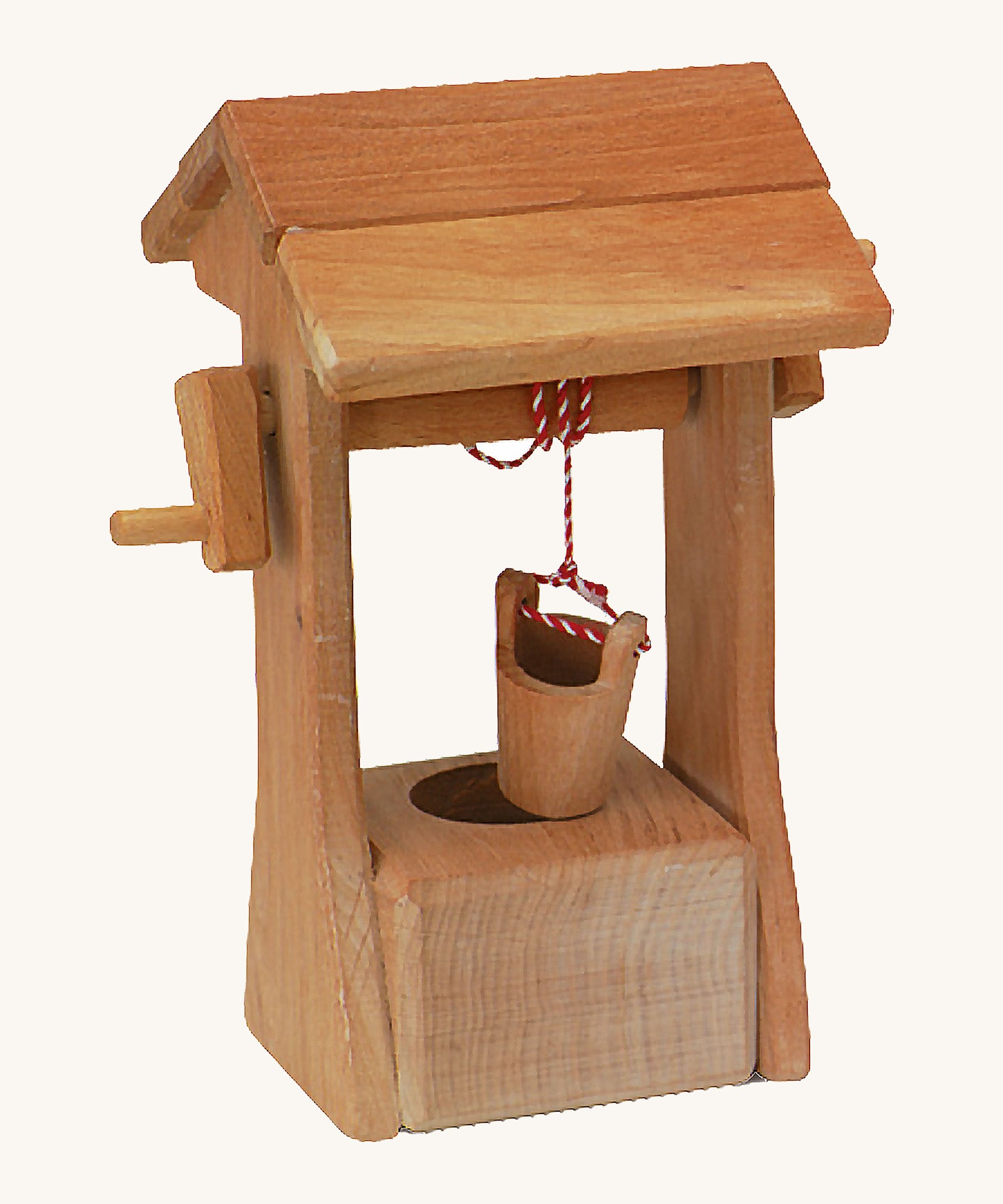 Ostheimer kids wooden water well toy with roof on a cream background.