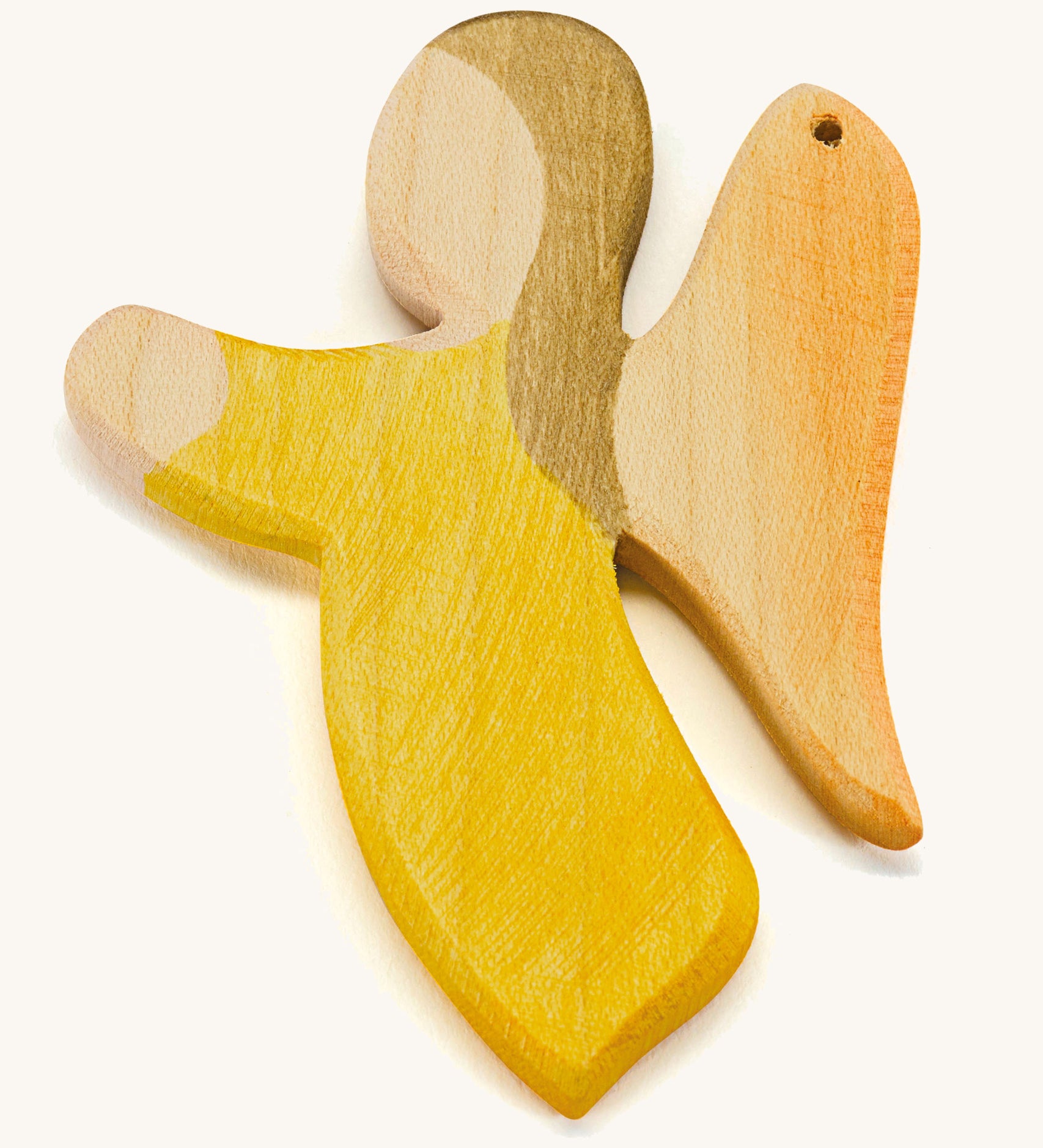 A yellow wooden angel figure on a cream background