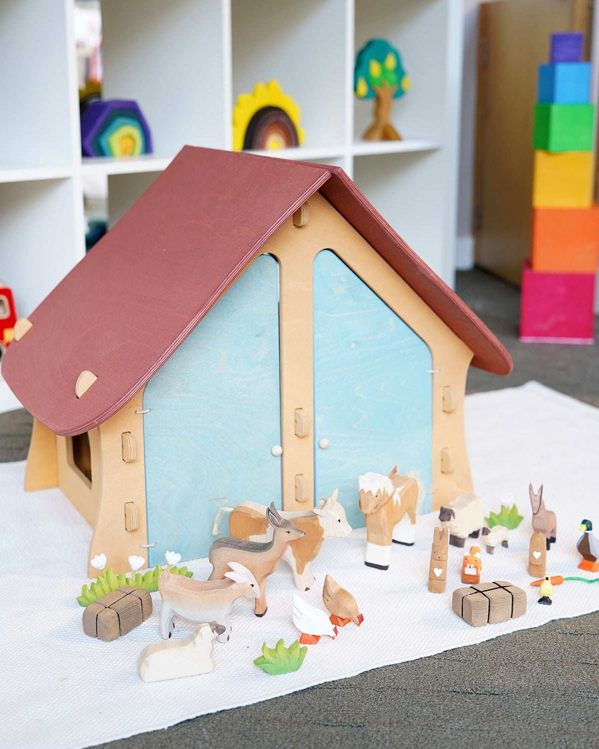 Ostheimer wooden farm house with light red roof and light blue doors