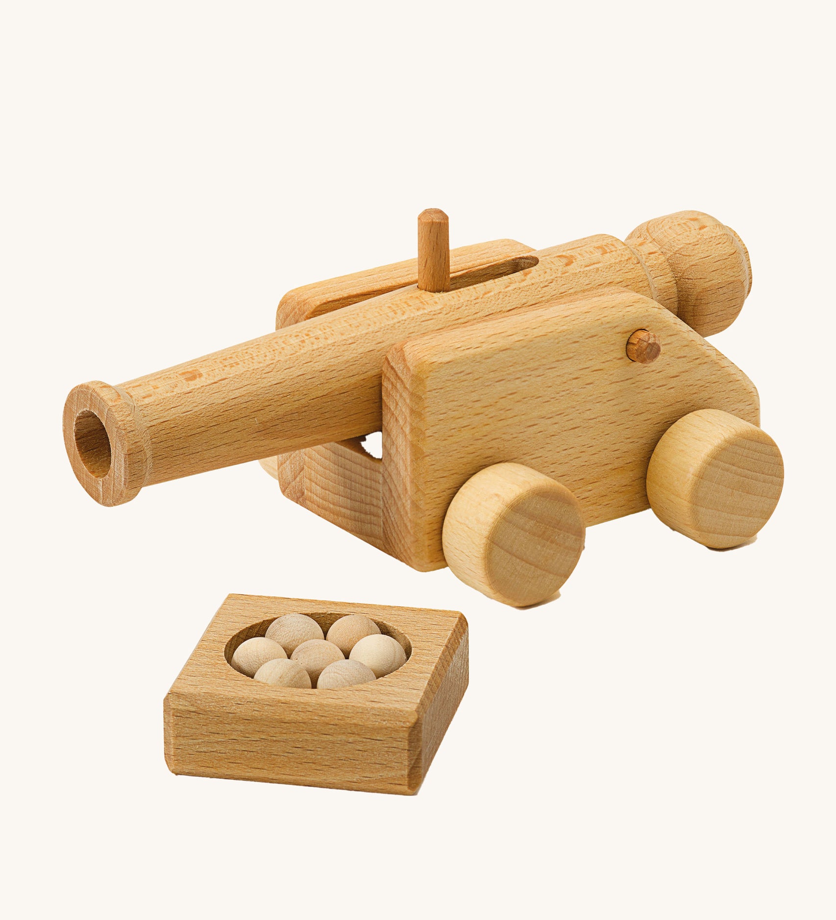 Ostheimer Small wooden Cannon toy With 5 cannon Balls on a plain background.