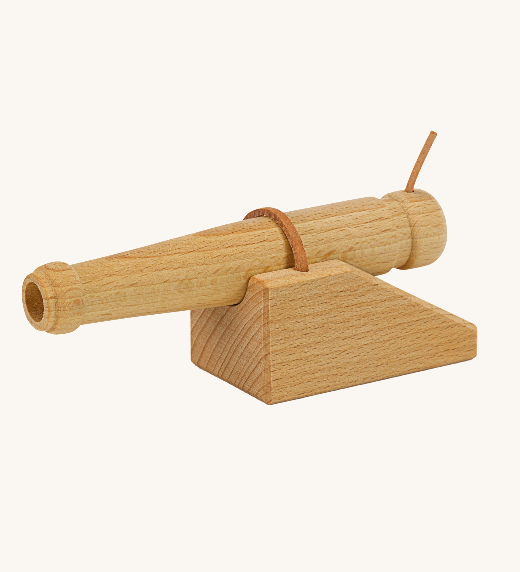 Ostheimer wooden cannon toy on a plain background. 