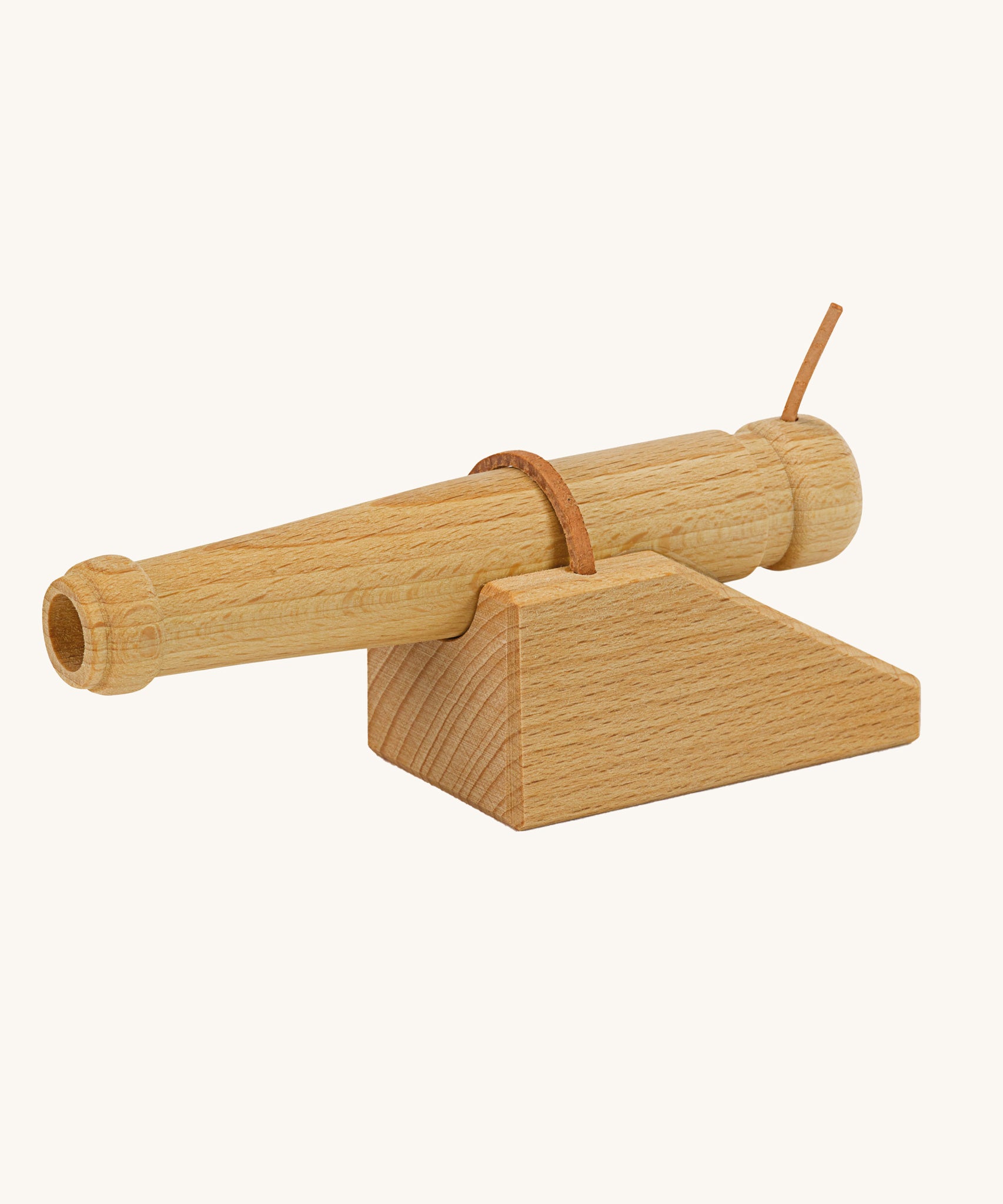 Ostheimer wooden cannon toy on a plain background. 