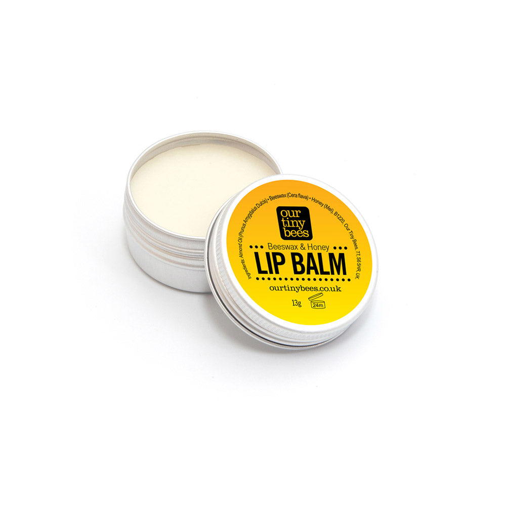 Our Tiny Bees Beeswax & Honey Lip Balm in tin on white background