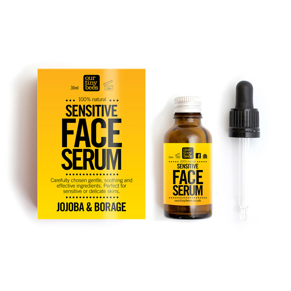 Our Tiny Bees Sensitive Face Serum in bottle next to box and pipette on white background