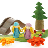 2 Papoose rainbow flowers on a white background in front of a green play mat with Papoose trees and a wooden bridge toy