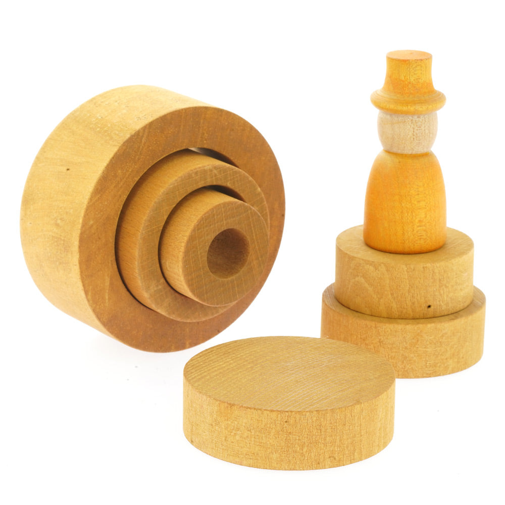 Papoose plastic-free wooden nesting tube toys on a white background next to a Grapat Nin and Papoose stacking discs