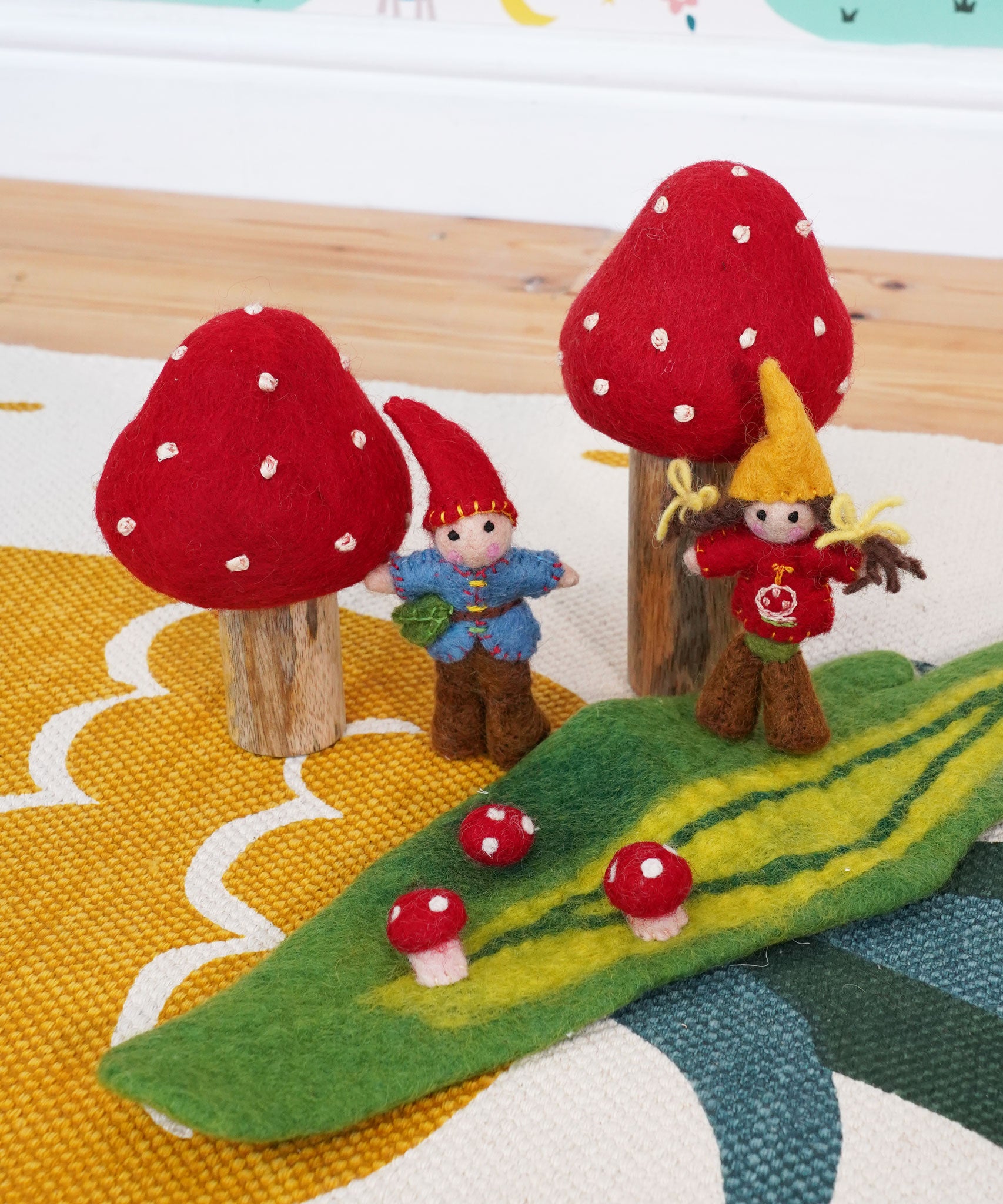 The Papoose Toys Toadstool Garden set up on a rug. 