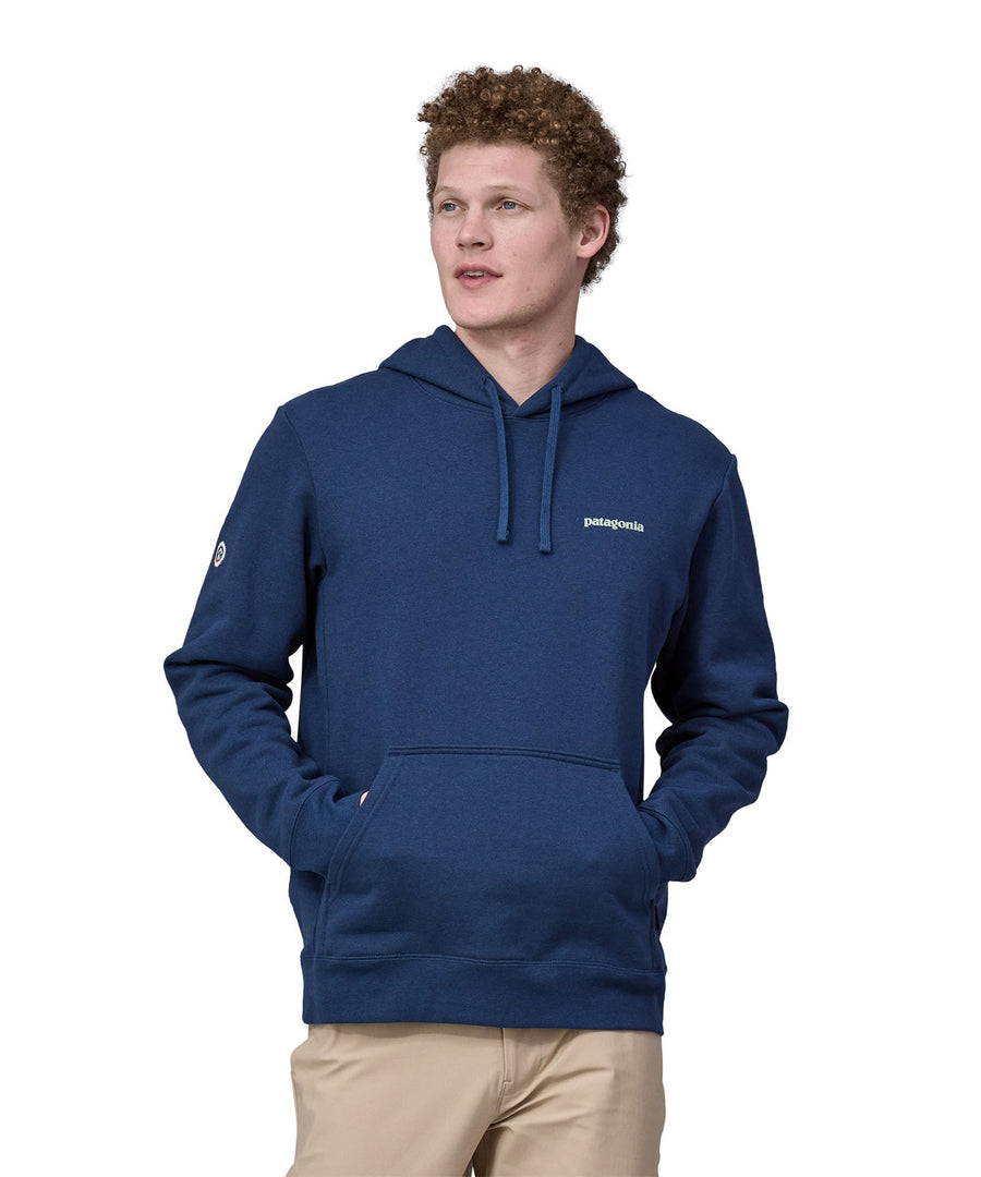 A man wearing the Patagonia Adult Fitz Roy Icon Uprisal Hoody Lagom Blue