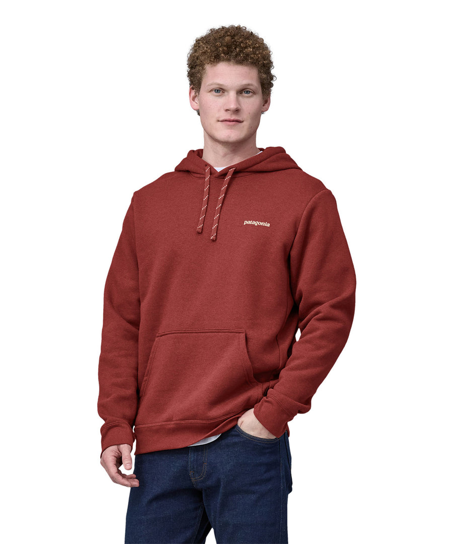 A man wearing the Patagonia Adult Fitz Roy Icon Uprisal Hoody Mangrove Red