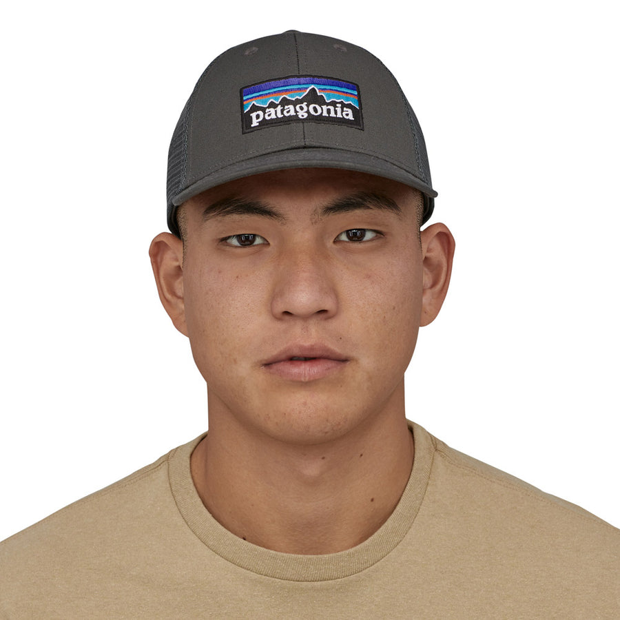 Close up of a man wearing the Patagonia eco-friendly recycled p6 logo snapback on a white background