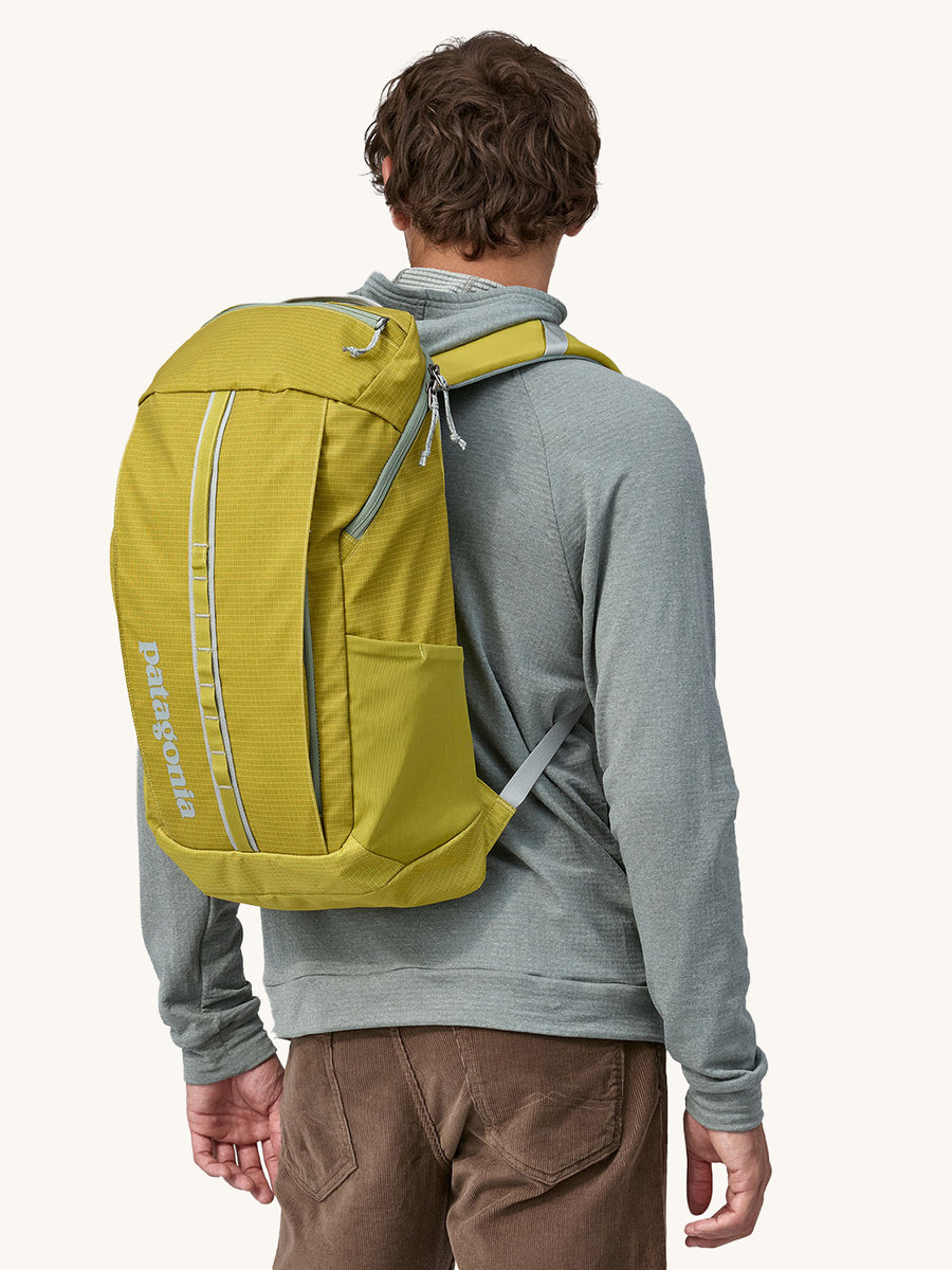 Patagonia Recycled Black Hole Backpack 25L in Shrub Green on a persons back