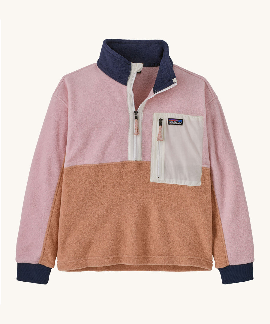 Patagonia Kids Microdini half Zip in a Terra Pink colour on a plain background. 