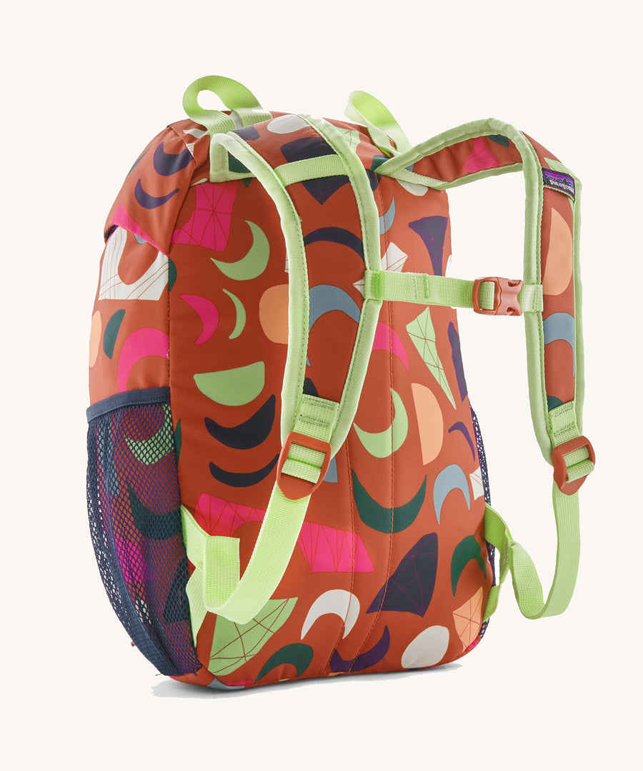 The back of a Patagonia Kids Refugito 12L in a Mirage design on a plain background.