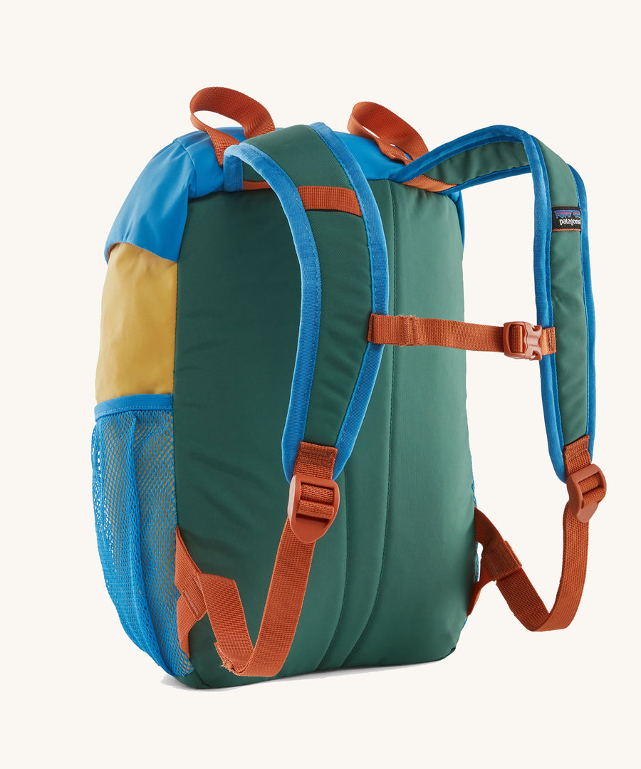 The back of a Patagonia Kids Refugito 12L in a Conifer Green colour way on a plain background. 